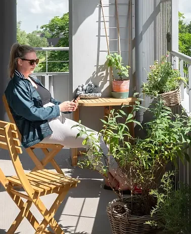 collective living - person sitting on balcony